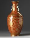 A Chinese coral-ground gilt-decorated slender vase