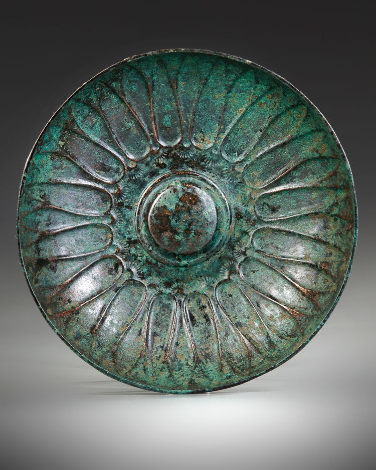 AN ACHAEMENID BRONZE DECORATED PHIALE, CIRCA 6TH-4TH CENTURY B.C.