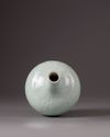 A celadon glazed bottle-vase