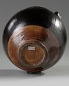 A Chinese brown-glazed ribbed jar