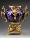 A FRENCH GILT SPELTER AND BLUE PORCELAIN FLOWER POT,  LATE 19TH CENTURY