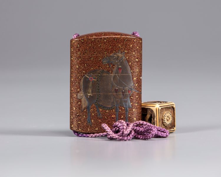 A Japanese Inro with a cubical shaped netsuke