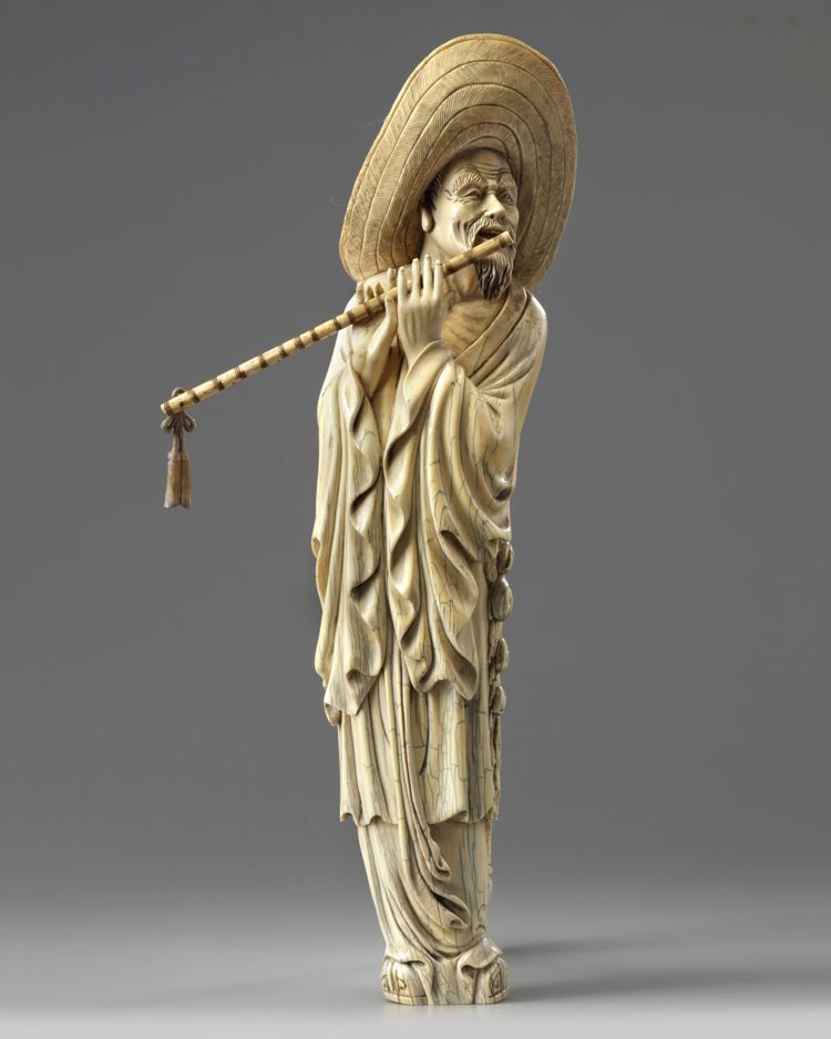 A CHINESE CARVED BONE MUSICIAN, 19TH-20TH CENTURY