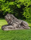 A SCULPTED LIMESTONE MODEL OF A RECUMBENT LION, SECOND HALF 20TH CENTURY