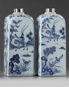 A pair of Chinese blue and white square bottles and silver covers