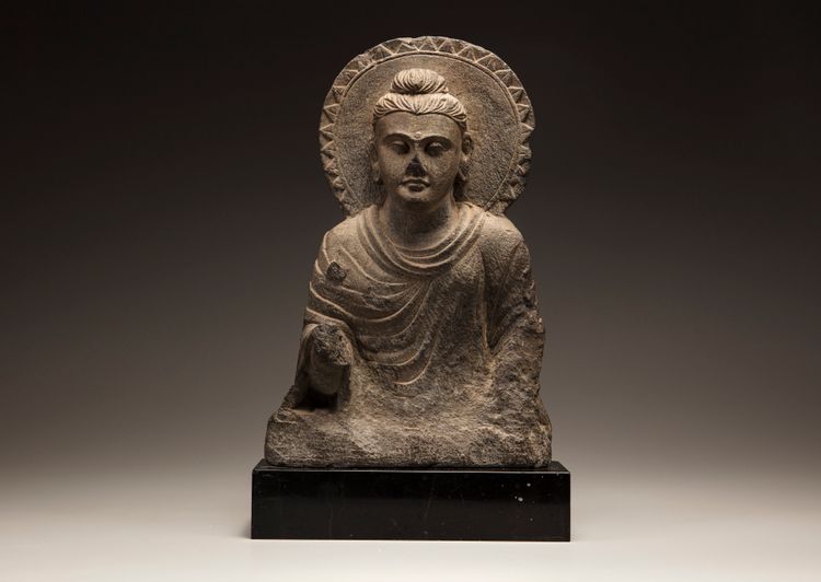 A Gandharan grey schist Buddha