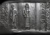 A WESTERN ASIATIC GREEN SERPENTINE CYLINDER SEAL, CIRCA 1900-1700 B.C.