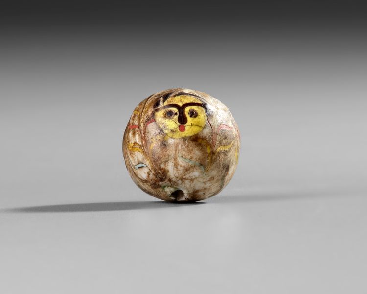 A LARGE SPHERICAL MOSAIC GLASS BEAD, ROMAN 1ST CENTURY AD