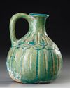 A TURQUOISE BLUE GLAZED POTTERY JUG, PERSIA, 10TH-11TH CENTURY
