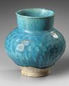 A TURQUOISE BLUE GLAZED POTTERY JUG, PERSIA-KASHAN, 12TH CENTURY