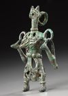 AN AMLASH OPENWORK BRONZE IDOL, CIRCA 1ST MILLENIUM B.C.