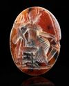 A ROMAN CARNELIAN INTAGLIO SHOWING FORTUNA SEATED, 2ND-3RD CENTURY AD