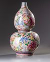 A Chinese famille rose 'millefleurs' double gourd vase