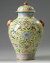 A Chinese yellow-ground famille rose 'Eight Immortals' vase and cover