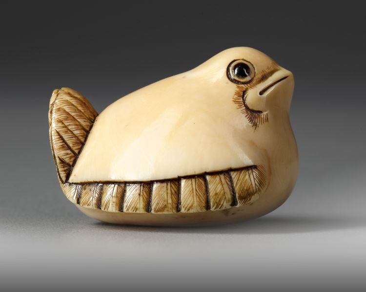 A JAPANESE IVORY NETSUKE OF THE SHAPE OF A SPARROW, SECOND HALF 19TH CENTURY