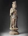A LARGE CHINESE POLYCHROME-DECORATED WOOD CARVING OF GUANYIN, POSSIBLY SONG-YUAN DYNASTY