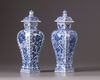 Two Chinese blue and white vases with covers