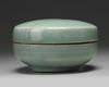 A KOREAN CELADON-GLAZED 'PHOENIX' BOX AND COVER