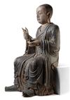 A CHINESE POLYCHROME-DECORATED WOOD LUOHAN, LATE MING DYNASTY, 17TH CENTURY