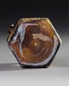 AN AMBER MOLDED GLASS JUGLET, EASTERN MEDITERRANEAN, 1ST–3RD CENTURY AD