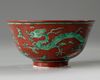 A Chinese red-ground green-enamelled 'dragon' bowl