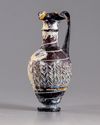 A Roman trefoil lipped purple glass jug