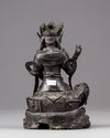 A Chinese Ming-style bronze figure of Guanyin seated on an elephant