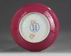 A CHINESE FAMILLE ROSE RUBY-BACK 'BIRD AND FLOWER' DISH