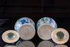 A pair of Chinese wucai glazed pots and covers