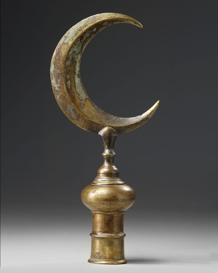 An Ottoman gilt-bronze tombak finial