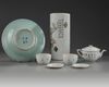 A Chinese famille rose hatstand, a famille rose three-piece tea set, and a celadon-ground blue and white dish