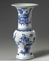A Chinese blue and white 'precious objects' phoenix tail vase