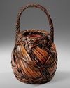 A JAPANESE BAMBOO IKEBANA BASKET, TAISHO PERIOD (1912-1926)