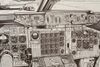 A print in a frame of the interior of the cockpit of a Boeing 747