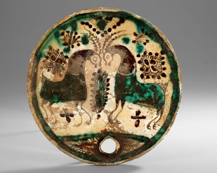 A KASHAN POTTERY PLAQUE, PERSIA, 12TH-13TH CENTURY