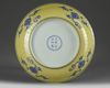 A Chinese yellow-ground blue and white 'gardenia' dish