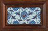 A PAIR OF FRAMED IZNIK TILES