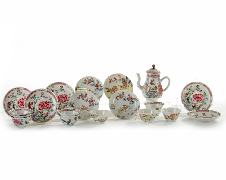 A group of Chinese famille rose cups and saucers, and a teapot
