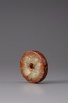 A celadon and russet jade bi