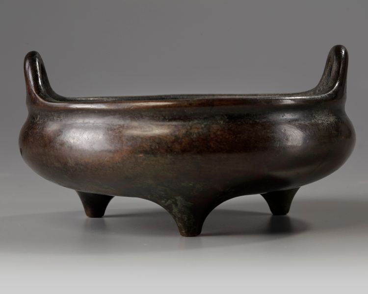 A Chinese bronze tripod censer