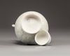 A Chinese celadon-glazed carved ewer and cover