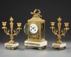A GILT BRONZE AND MARBLE FIREPLACE SET, LOUIS XVI STYLE, 19TH CENTURY