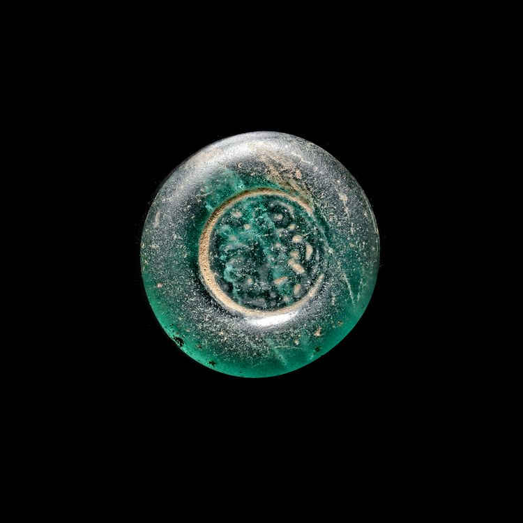 A FATIMID GLASS WEIGHT OF DOUBLE DIRHAM, AL-HAKIM BI-AMR ALLAH (386AH-411AH/ 996AD-1021AD)