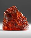 AN AMBER BOULDER CARVING, CHINA, QING DYNASTY (1644-1912)