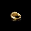 A LARGE ROMAN GOLD RING WITH AN INTAGLIO OF A COW, 1ST-2ND CENTURY AD