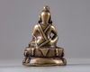A bronze seated figure