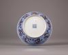 A Chinese iron-red-decorated blue and white 'dragon' dish