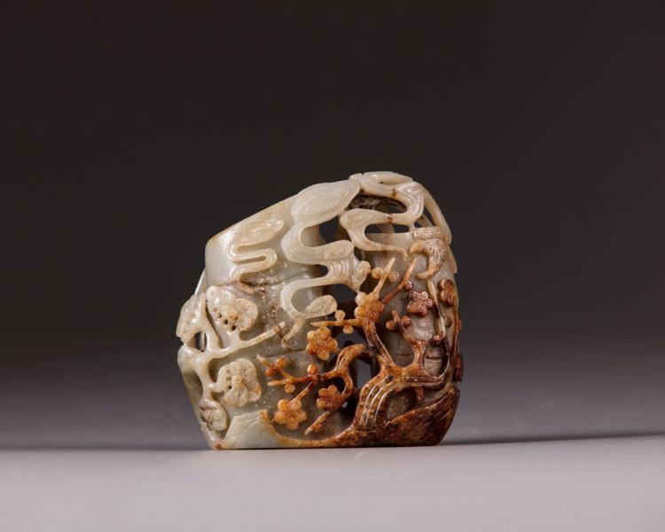 A Chinese celadon and russet jade 'three friends of winter' spill vase