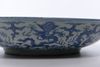 A LARGE CHINESE BLUE AND WHITE DRAGONS DISH, MING DYNASTY (1368-1644) OR LATER