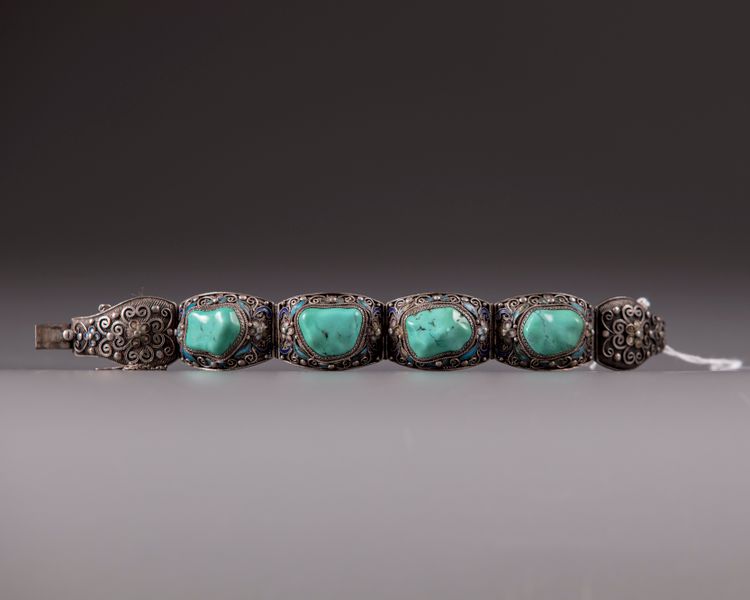 A silver filigree bracelet with Turquoise inlay
